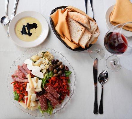 Antipasti for two - marinated artichokes, prosciutto, salami, sun dried tomatoes, olives, roasted peppers & market cheeses.