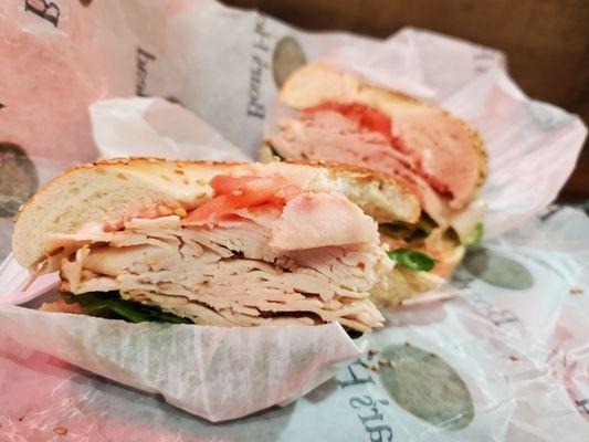 Boars head chix with lettuce and mayo on a sesame seed bagel