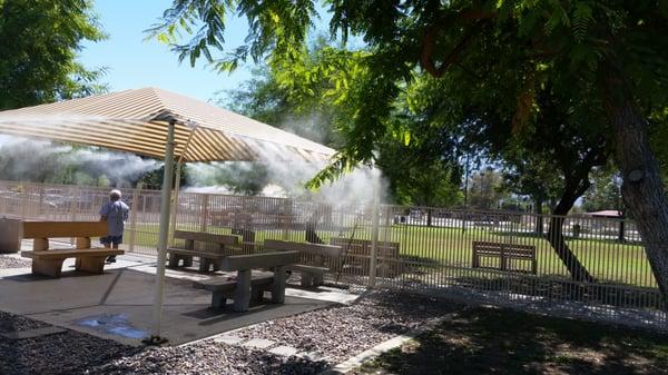 Shade trees, benches, misters. Nice for the owners too!