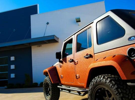 Custom jeep parked outside Starwood