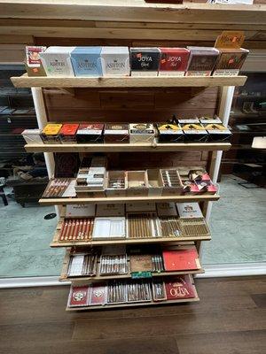 The display of tin's of cigars and the Macanudo brand and The American Classic.