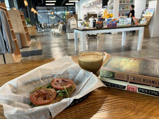 Avocado toast, oatmilk latte with honey and some newly purchased books to keep me company