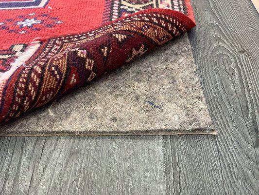 We sell premium-grade rug pad! We custom cut it to fit your rug