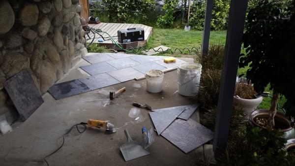 Outdoor patio to a stone house--this is the before photo at start of job.