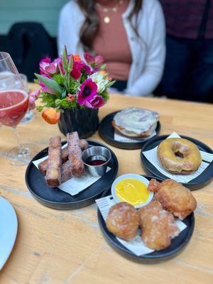 French Toast Sticks. Zeppole w/ Meyer lemon curd. Cinnamon Roll. Cake Donut w/ Passionfruit Glaze.