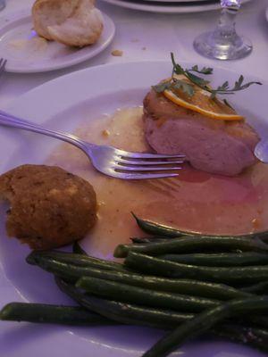 Duck. Excellent sauce. Skin was improperly crisped and fat was no rendered out. The grape stuffing ball on the left tasted like stove top.