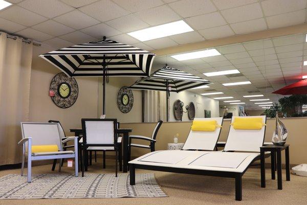 Umbrella, dining and chaise lounge set.