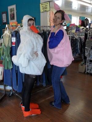 two volunteers having fun with donated duckie and piggie costumes