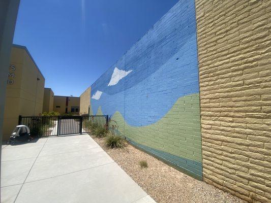 Here is a beautiful mural that leads from the two year old and preschool classrooms to the playground.