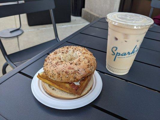 Breakfast sandwich with Sriracha aioli and an iced latte