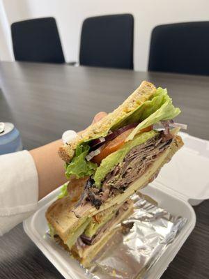 Huge portion Roast beef, avocado, Swiss cheese on rye