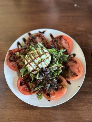 Burrata with fresh tomatoes and greens