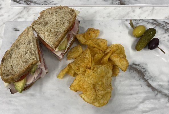 What's The Dill...Turkey, Ham, Avocado, Tomato, Jalapeño Dill Sauce, and Provolone Cheese on multigrain wheat bread $12.99