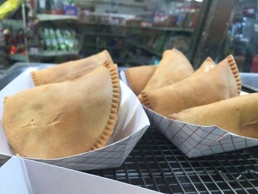 Meat Pies filled with ground meat, seasoning, & spices.