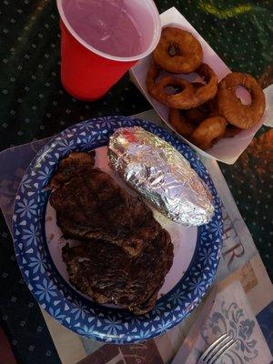 Ribeye, baked potato, onion rings