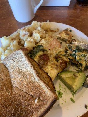 Salmon omelette with avocado and home fries