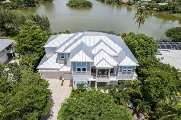 Custom coastal style two-story home with more than 3,550 sq. ft. of living space built on Sanibel Island, FL.