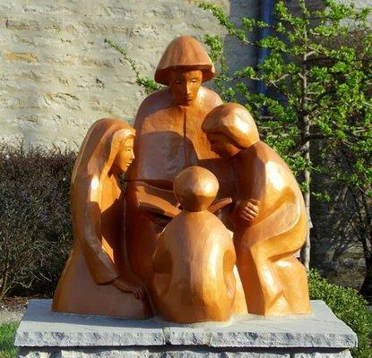 Statue on the side of church.