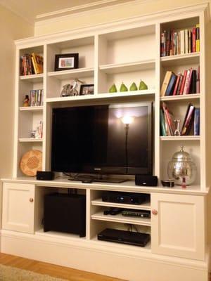 This wall unit in Foxborough complements the original details of the home yet is cost-effective.