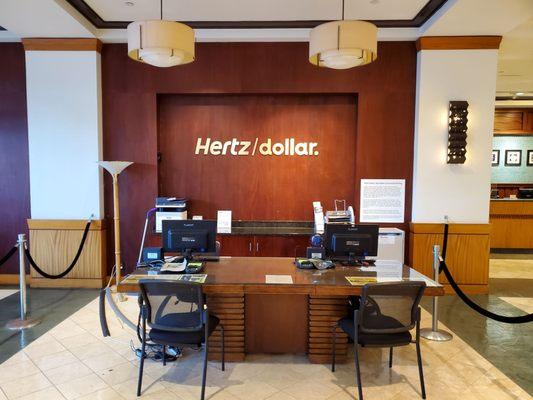 The Hertz/Dollar rental car inside of the Ilikai Hotel.