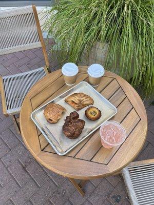 Cappuccinos, watermelon shrub, and pastries. Outdoor seating.