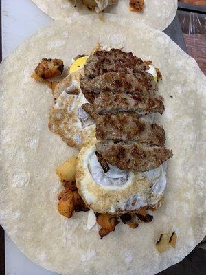 Sausage with egg with home fries on Wrap