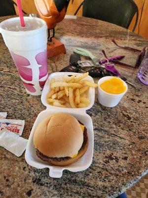 Cheeseburger, fries with cheese cup and medium coke