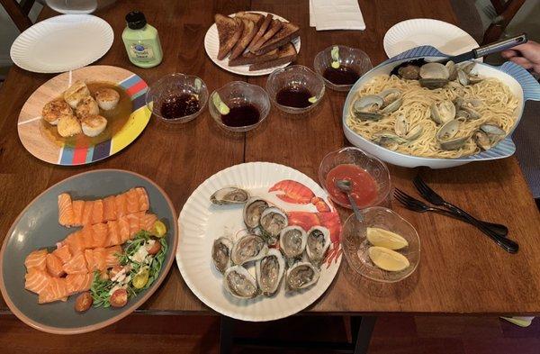 Salmon sashimi, freshly shucked oysters, calms with fresh pasta (pasta also purchased at the market) and buttery lemon scallops.