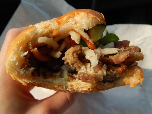 A couple bites into the BBQ pork Bahn Mi, lots of meat!