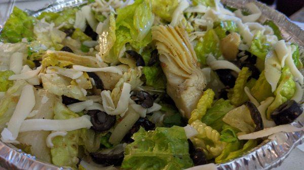 Artichoke Tossed salad, plenty of olives, artichokes and that dressing is truly home made deliciousness