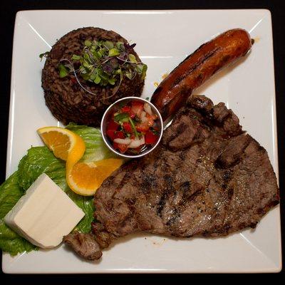 CARNE ASADA - Grilled juicy sirloin steak and chorizo served with black bean rice, white cheese and pico de gallo.