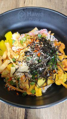 Bowl: salmon, tuna, masago, pineapple, mango, daikon, seaweed salad, kani, corn, avo, cucumber, house ginger + unagi sauce