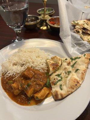 Garlic naan bread, rice and chicken curry