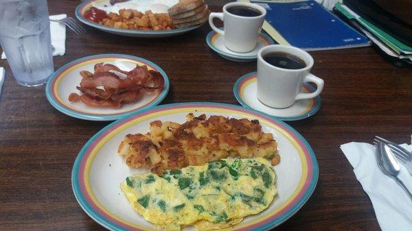 Spinach and Cheese Omelette with a sider of bacon.