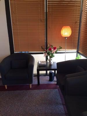 Clean waiting room with fresh flowers and that awesome spa music