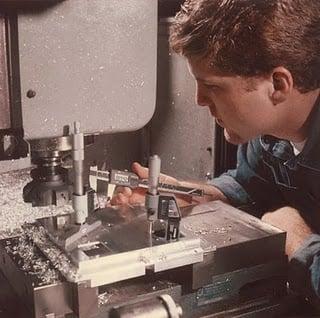 Michael Elson, Vice President of Penn Tool Co., working in a machine shop.
    Picture taken 1994.