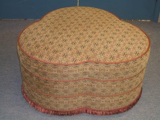 Upholstered ottoman with Frindge