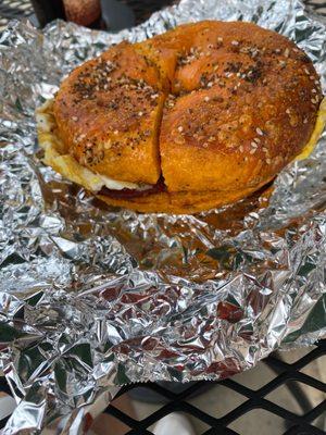 Egg everything bagel with sausage egg and cheese