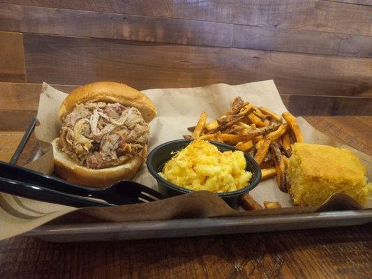 Pulled pork sandwich, mac, fries and cornbread