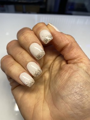 White dip powder and gold sprinkles on edge