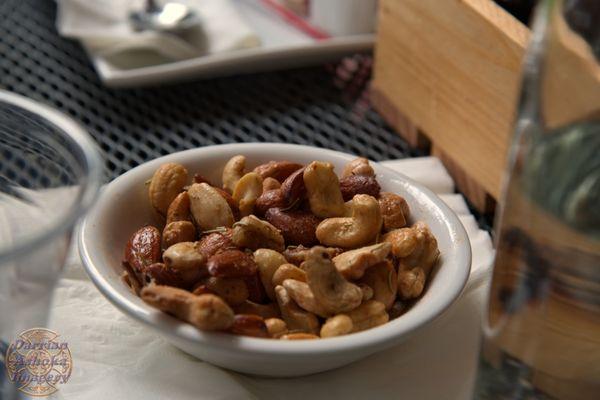 Warm roasted nuts with rosemary.