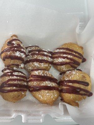 DEEP FRIED LEMON OREOS w/ FRESH BLUEBERRY SAUCE.