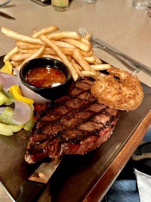 NY Strip w/ coconut prawns. My daughter liked the steak but instead of medium rare it was very well done. :(