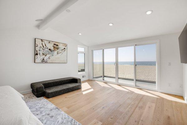 New beach house M. bedroom with large slide door and ocean view