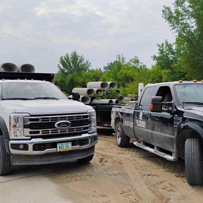 Landscaping Trucks Hauling Paver Patio Debris Away for a new install