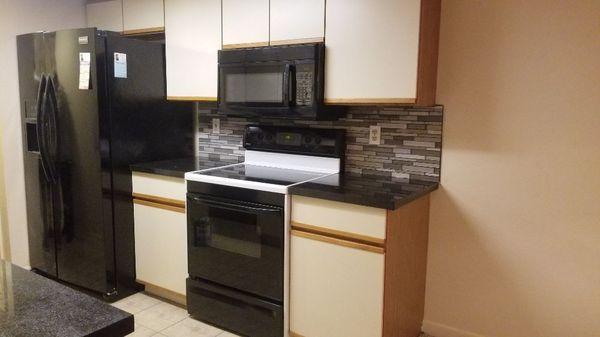 Completed installation on the countertop  microwave  &glass backsplash