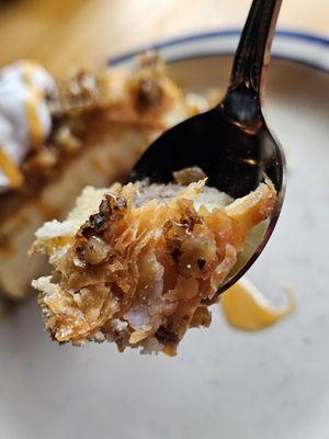 A spoonful of the Baklava Cheesecake getting ready to be eaten and savored.