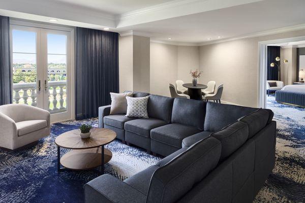 The inviting living area of the 1-bedroom suite showcases contemporary furnishings bathed in natural light.