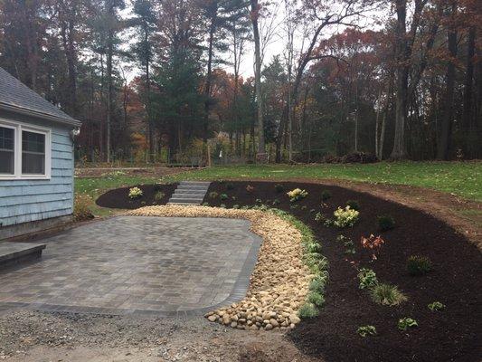 Paver Patio with Slope Plantings