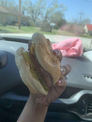 Cheeseburger with pickles, tomato, onion